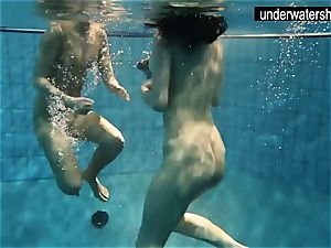 two stunning amateurs showing their figures off under water